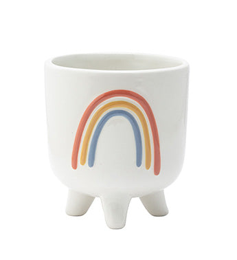 White footed planter with a colorful rainbow design on a white background