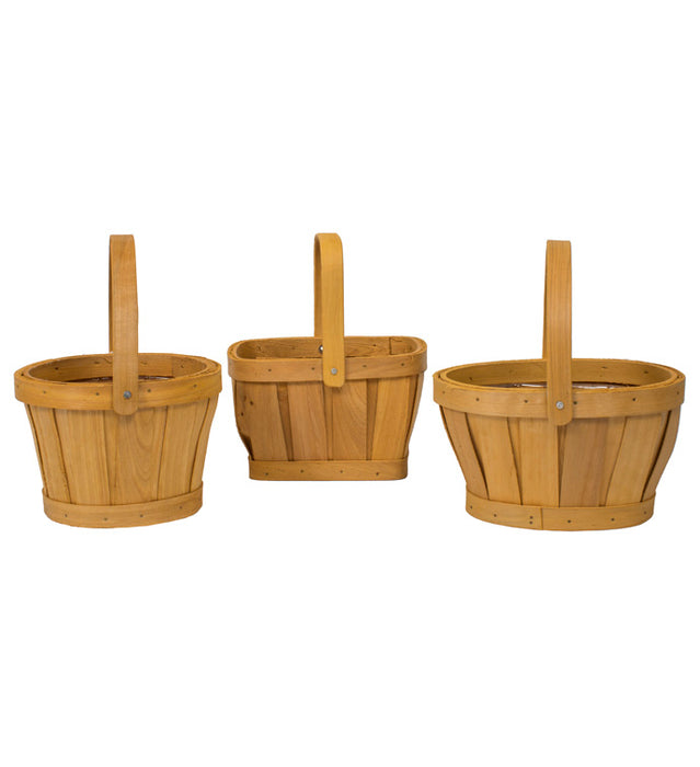 Three wooden baskets with handles on a white background
