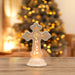 Image of Light Up Cross with Christmas Tree in Background