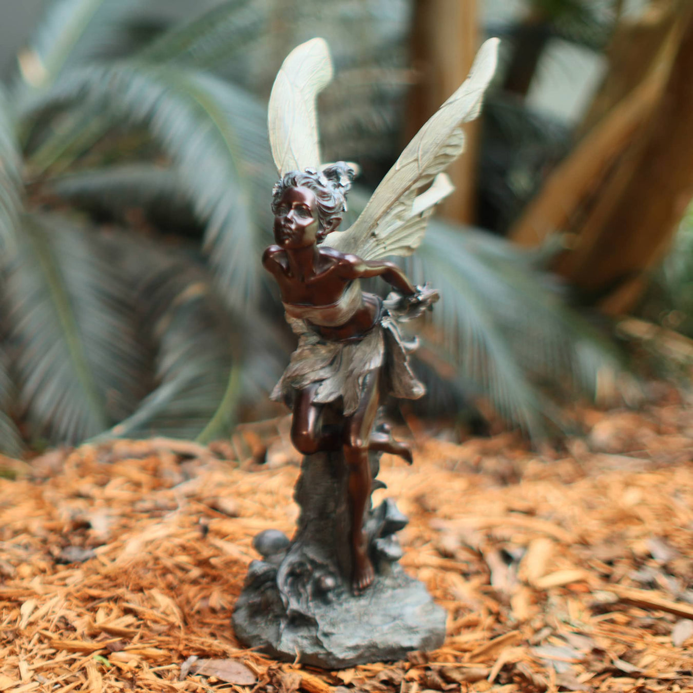 Bronze Kissing Fairy in Garden