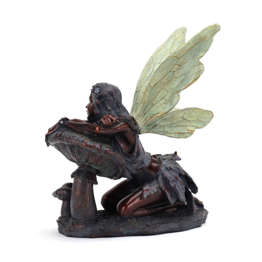 Bronze fairy on mushroom, back view