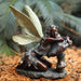 Bronze fairy on mushroom in garden