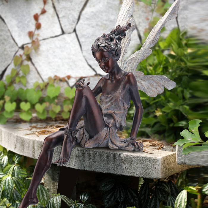 Bronze Sitting Fairy in Garden